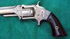 A pistol engraved by Rachel.